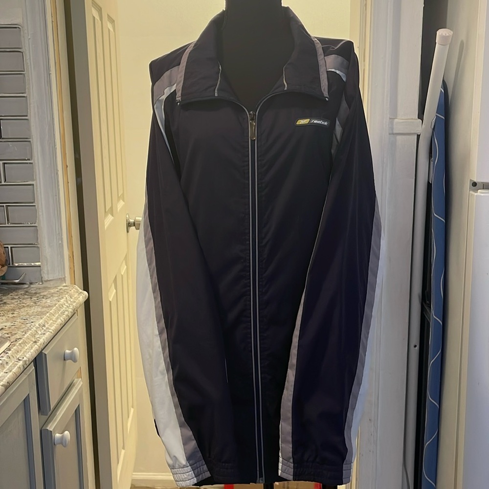 Reebok men’s jacket. Black white grey stripe, Zip pockets & front zipper